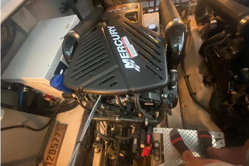 Slide: The Image of Engine room of a 2007 Sea Ray 40 Sundancer with Mercury engine components. - 27