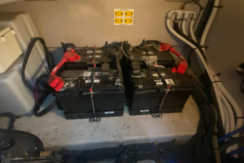 Slide: The Image of Batteries in the engine room of a 2007 Sea Ray 40 Sundancer boat. - 28