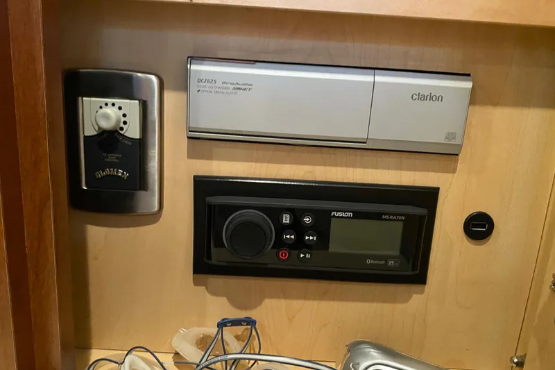 Slide: The Image of Control panel of a 2007 Sea Ray 40 Sundancer with Clarion and Fusion audio systems. - 36