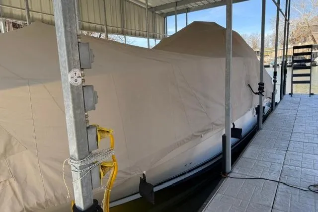 Slide: The Image of Covered 2007 Sea Ray 40 Sundancer docked under shelter. - 48