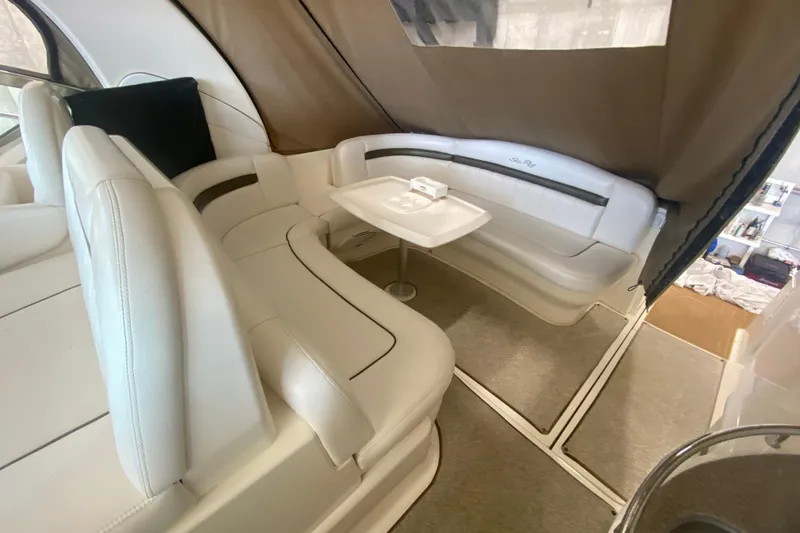 Slide: The Image of Interior of 2007 Sea Ray 40 Sundancer with white leather seating and table. - 5