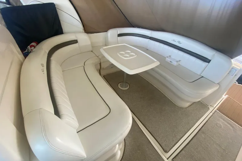Slide: The Image of Interior of 2007 Sea Ray 40 Sundancer with white leather seating and table. - 8
