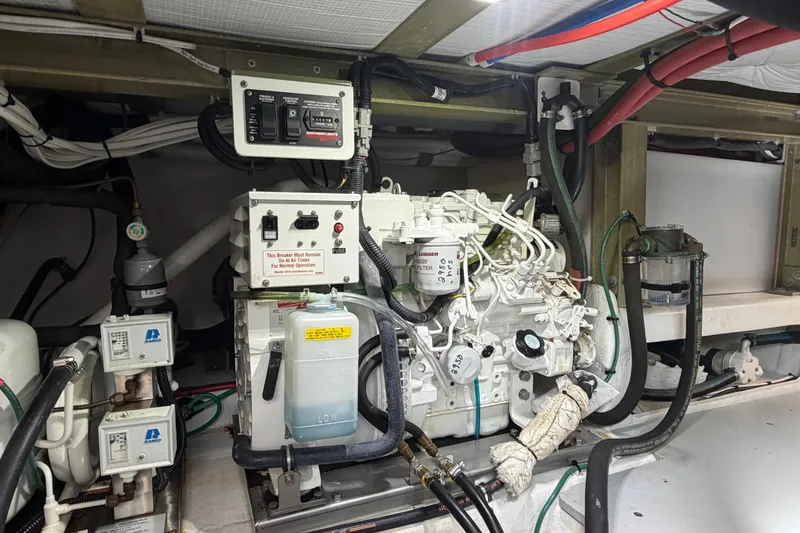 Slide: The Image of Engine room of 2018 H&H Marine Osmond Beal boat, featuring mechanical components and wiring. - 90