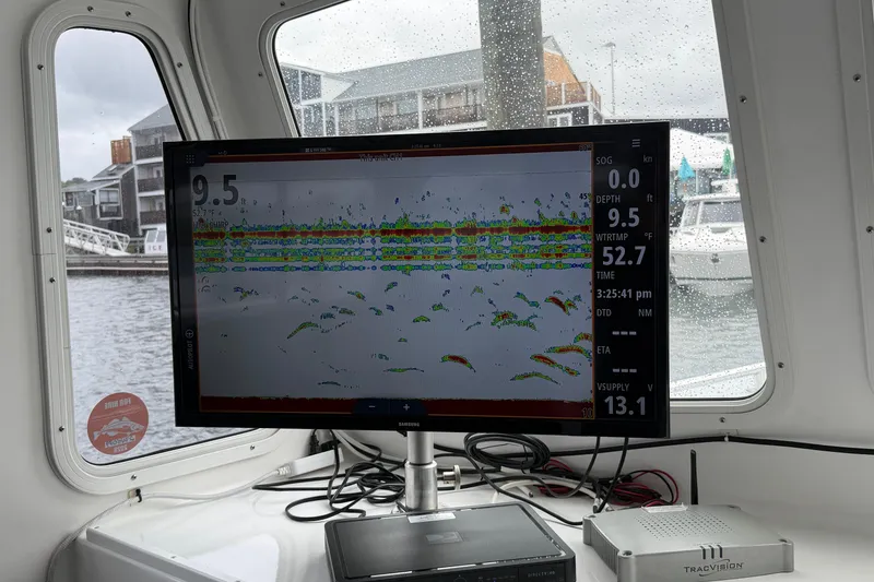 Slide: The Image of Fishfinder display on 2018 H&H Marine Osmond Beal boat, showing depth and water temperature. - 35
