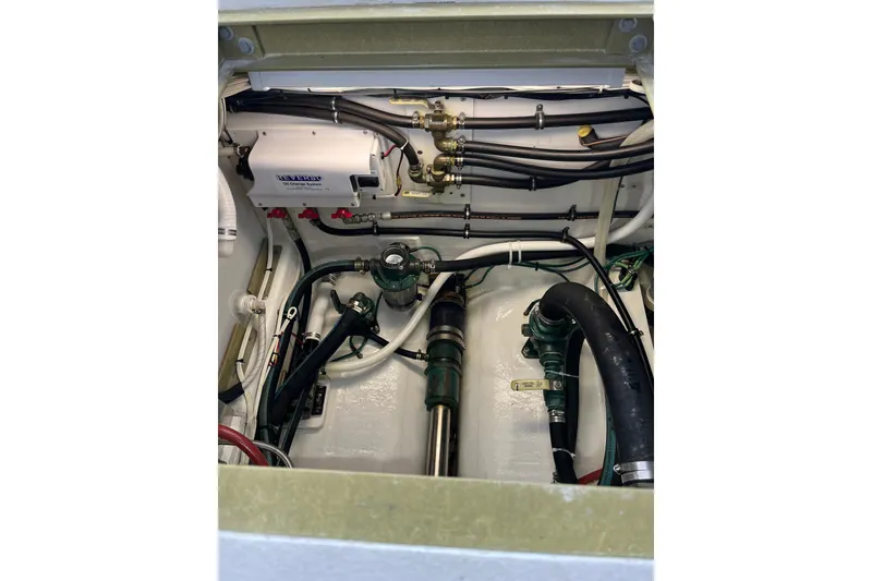 Slide: The Image of Engine compartment of a 2018 H&H Marine Osmond Beal boat, showcasing mechanical components. - 94