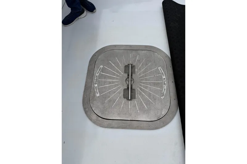 Slide: The Image of H&H Marine Osmond Beal 2018 boat hatch with metal handle on deck. - 78