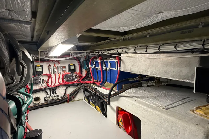 Slide: The Image of Engine room of 2018 H&H Marine Osmond Beal boat, featuring wiring and equipment. - 65
