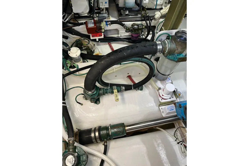 Slide: The Image of Engine room of 2018 H&H Marine Osmond Beal with hoses and mechanical components. - 98