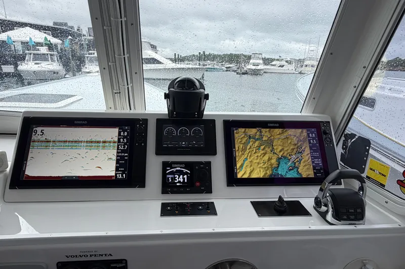 Slide: The Image of Helm of 2018 H&H Marine Osmond Beal boat with navigation displays and controls. - 32