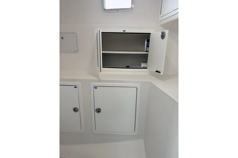 Slide: The Image of Interior storage compartments on a 2018 H&H Marine Osmond Beal boat. - 52