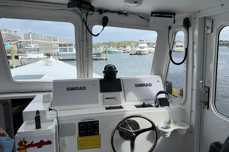 Slide: The Image of Interior view of 2018 H&H Marine Osmond Beal boat with Simrad navigation system. - 41