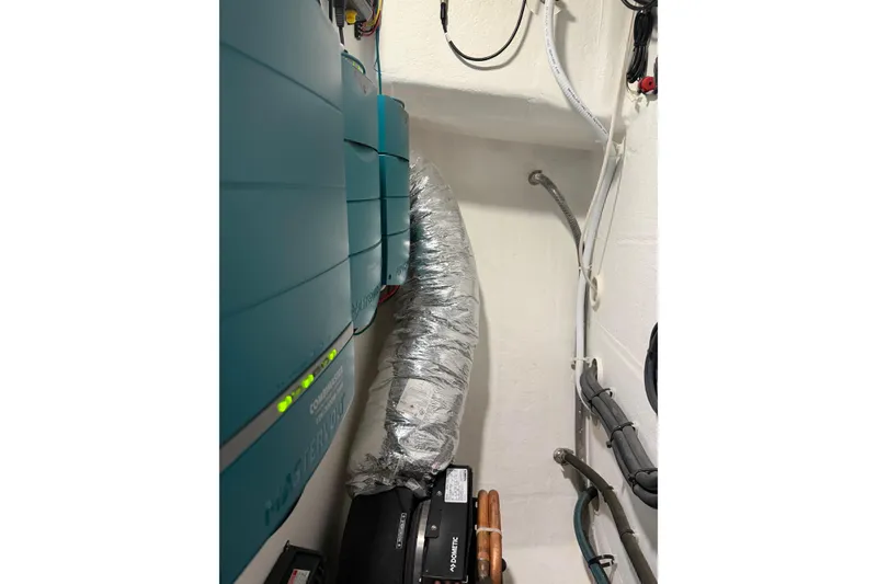 Slide: The Image of Electrical equipment and wiring inside a 2018 H&H Marine Osmond Beal boat. - 71