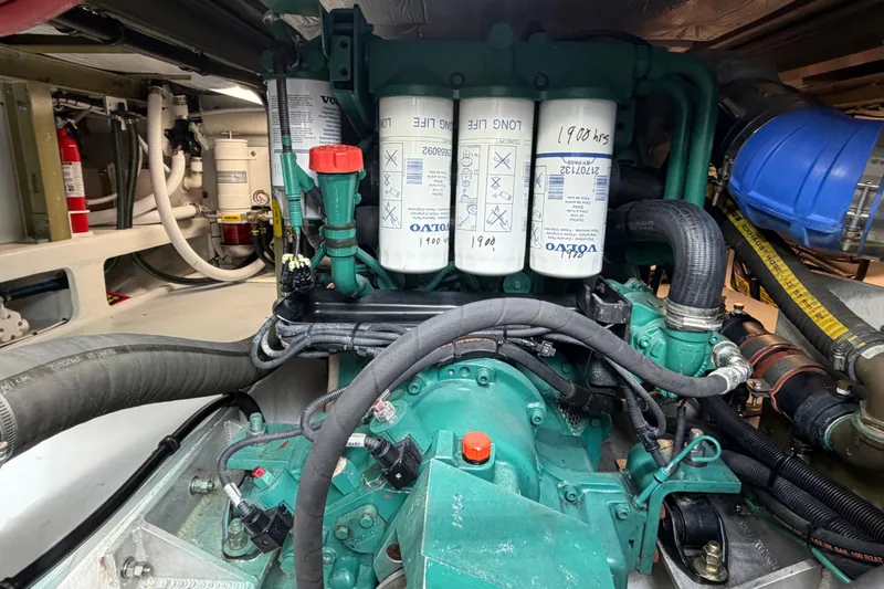 Slide: The Image of Engine compartment of a 2018 H&H Marine Osmond Beal boat, featuring Volvo components. - 88
