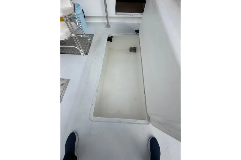 Slide: The Image of 2018 H&H Marine Osmond Beal boat interior with open storage compartment. - 29