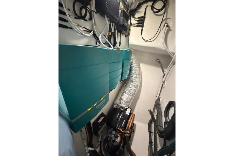 Slide: The Image of Electrical system inside a 2018 H&H Marine Osmond Beal boat, featuring wiring and components. - 70