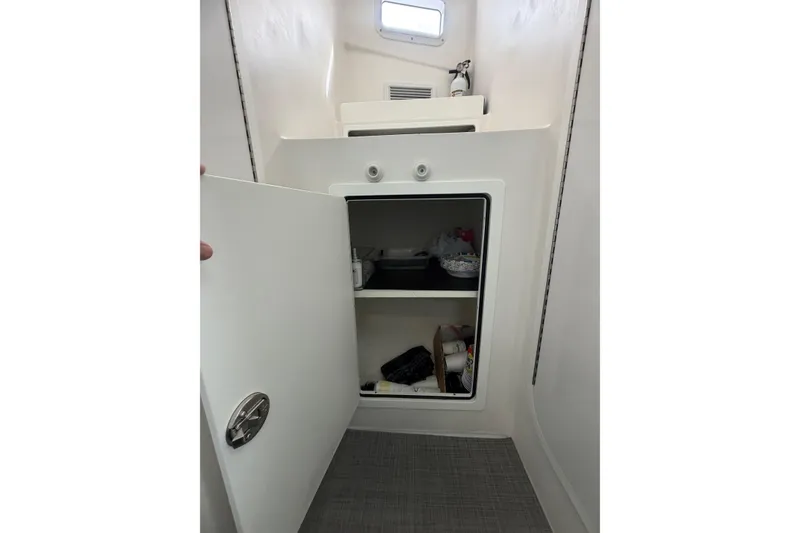 Slide: The Image of Interior storage compartment on a 2018 H&H Marine Osmond Beal boat. - 68
