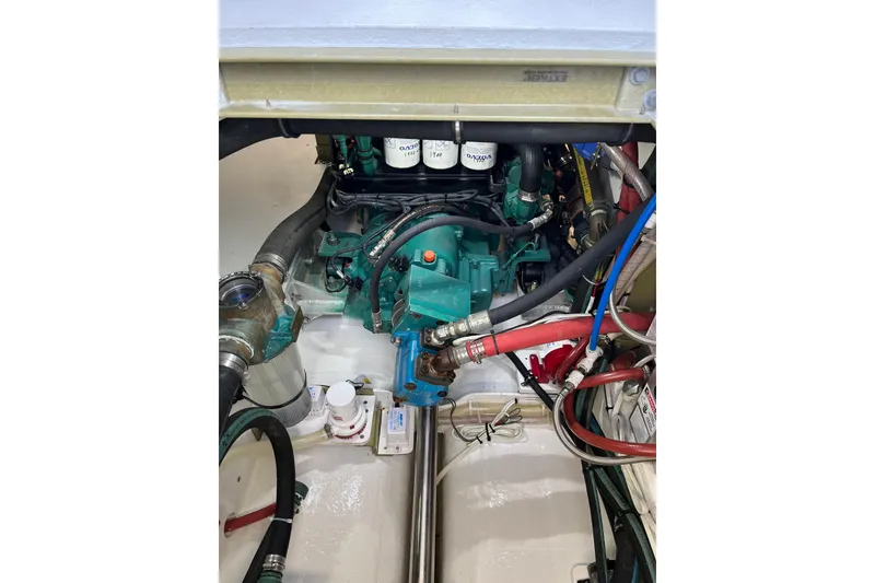 Slide: The Image of Engine compartment of a 2018 H&H Marine Osmond Beal boat, showcasing mechanical components. - 99