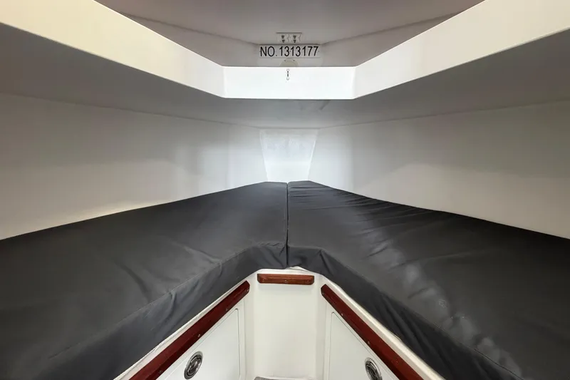 Slide: The Image of Interior cabin of 2018 H&H Marine Osmond Beal boat, featuring sleek design and storage. - 48