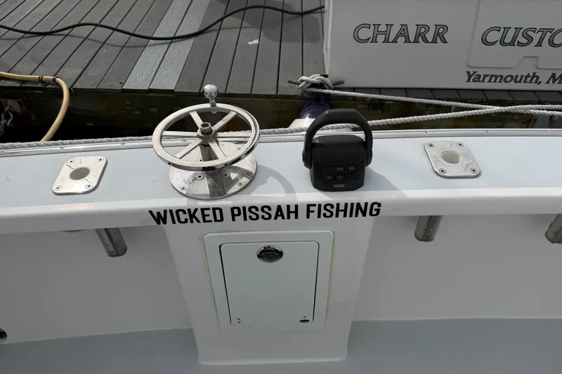 Slide: The Image of 2018 H&H Marine Osmond Beal boat with "Wicked Pissah Fishing" text on deck. - 23