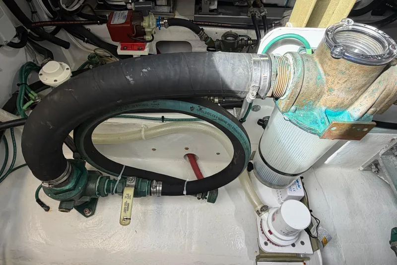 Slide: The Image of Engine room of 2018 H&H Marine Osmond Beal boat with hoses and filters. - 91