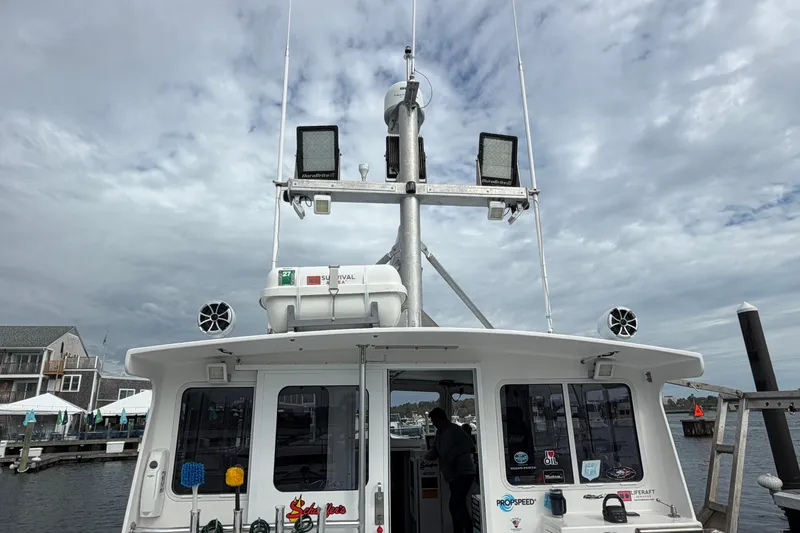 Slide: The Image of 2018 H&H Marine Osmond Beal boat docked under cloudy skies. - 24