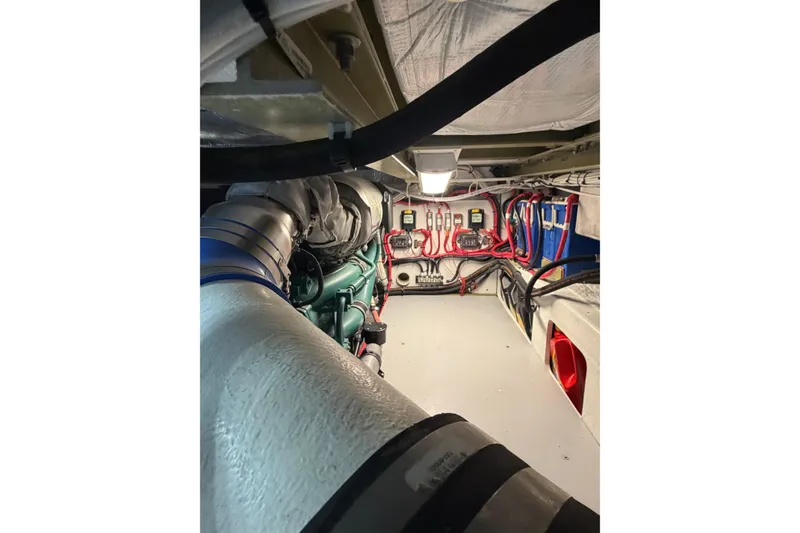 Slide: The Image of Engine room of a 2018 H&H Marine Osmond Beal boat, showcasing wiring and components. - 66
