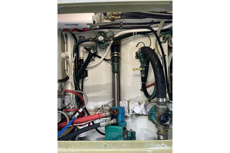 Slide: The Image of Engine room of 2018 H&H Marine Osmond Beal boat, showcasing complex piping and machinery. - 100