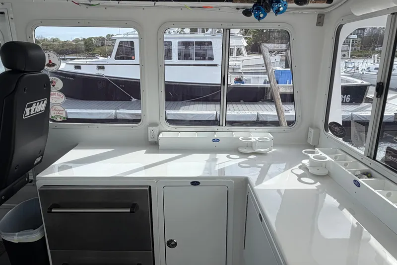 Slide: The Image of Interior of a 2018 H&H Marine Osmond Beal boat with dock view. - 40