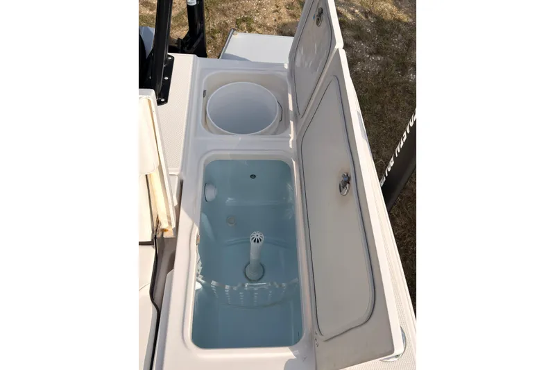 Slide: The Image of Livewell and storage compartments on a 2022 Robalo 266 Cayman boat. - 31