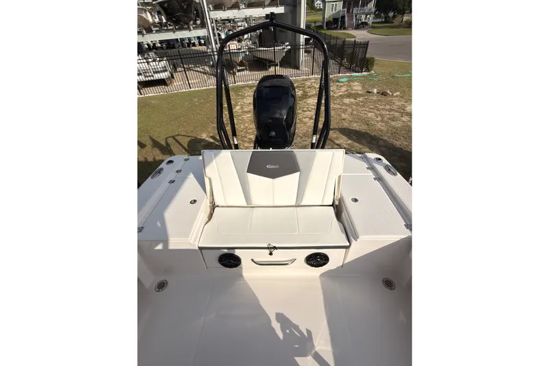Slide: The Image of 2022 Robalo 266 Cayman boat interior with seating and storage area. - 25