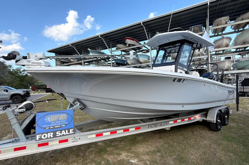 Slide: The Image of 2022 Robalo 266 Cayman boat on trailer, for sale at Coastal Boat Pros. - 0