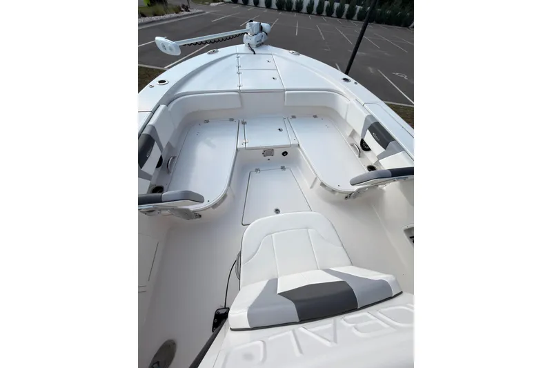 Slide: The Image of 2022 Robalo 266 Cayman boat interior with seating and storage compartments. - 22