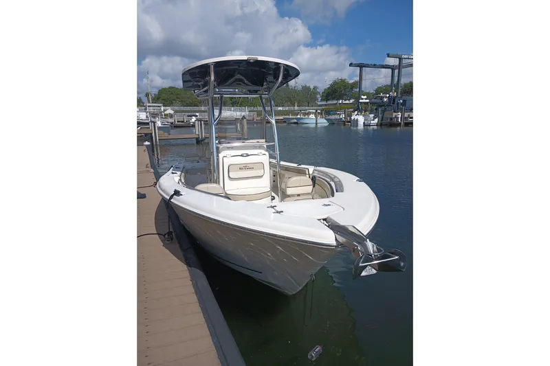 The Image of 2022 Sea Chaser 22 HFC boat docked at marina under blue sky. - 0