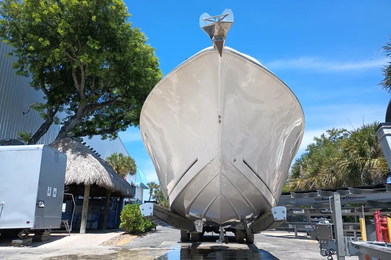 Slide: The Image of 2022 Sea Chaser 22 HFC boat on trailer, surrounded by trees and blue sky. - 6