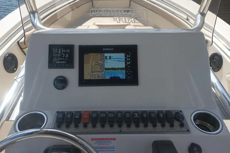 Slide: The Image of Dashboard of a 2022 Sea Chaser 22 HFC boat with navigation and control panels. - 12