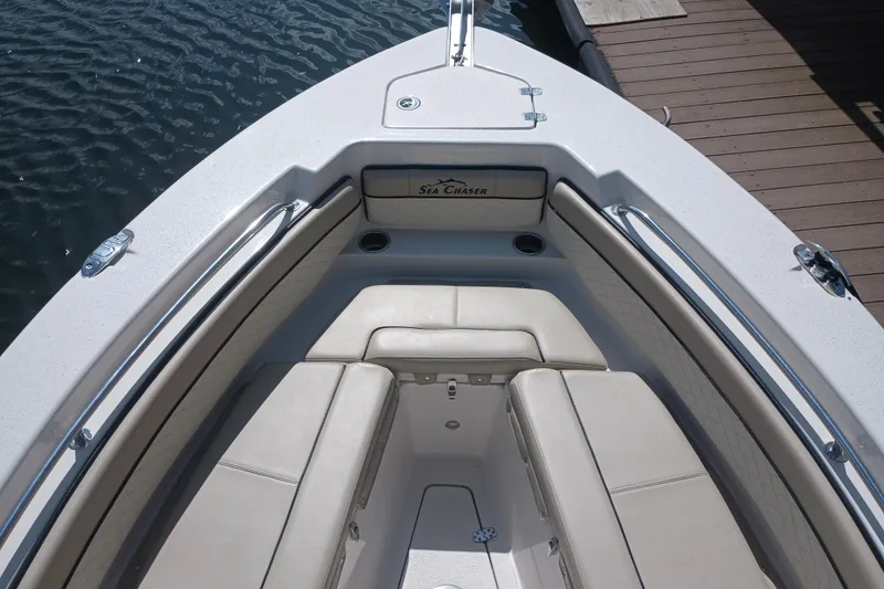 Slide: The Image of 2022 Sea Chaser 22 HFC boat interior with cushioned seating and sleek design. - 25
