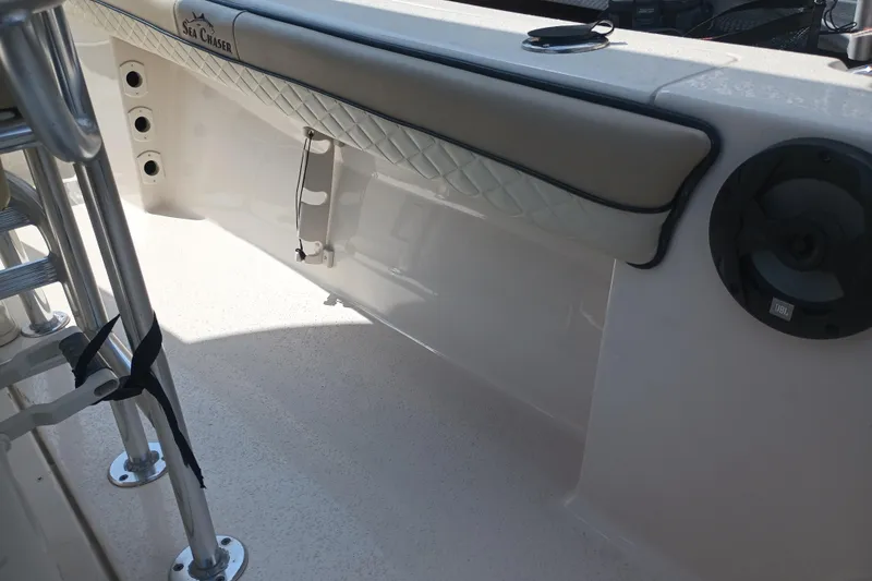 Slide: The Image of 2022 Sea Chaser 22 HFC boat interior with speaker and padded railing. - 30