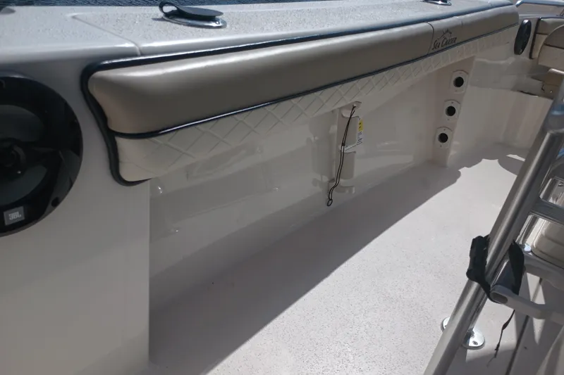 Slide: The Image of 2022 Sea Chaser 22 HFC boat interior with cushioned seating and speaker. - 31