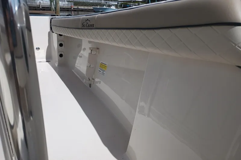 Slide: The Image of 2022 Sea Chaser 22 HFC boat interior with cushioned seating and sleek design. - 33