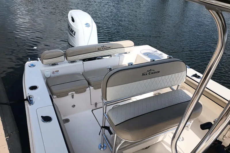 Slide: The Image of 2022 Sea Chaser 22 HFC boat interior with Suzuki engine on water. - 4