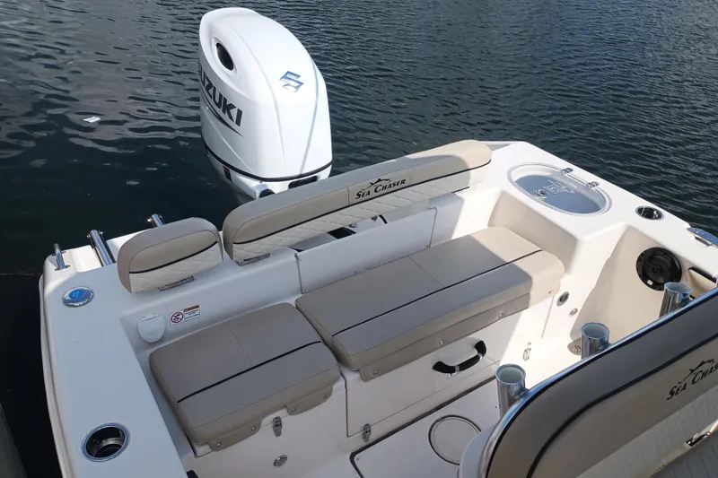 Slide: The Image of 2022 Sea Chaser 22 HFC boat with Suzuki outboard engine on water. - 5