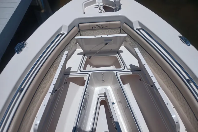 Slide: The Image of 2022 Sea Chaser 22 HFC boat with open storage compartments on deck. - 36