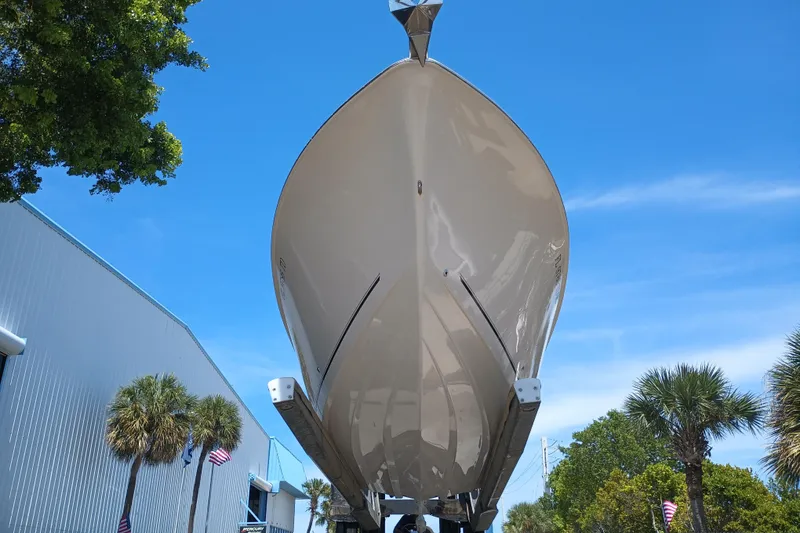 Slide: The Image of 2022 Sea Chaser 22 HFC boat under clear blue sky, viewed from below. - 7