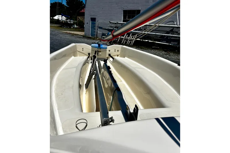 Slide: The Image of Interior view of a 2018 American Sail 14.6 sailboat, showcasing rigging and seating. - 4