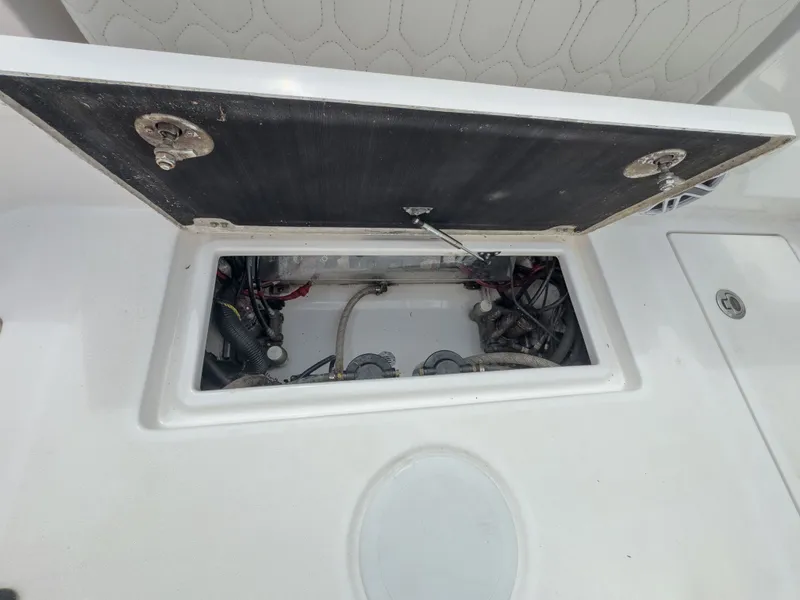 Slide: The Image of Open storage compartment on a Sea Fox 288 Commander boat. - 22