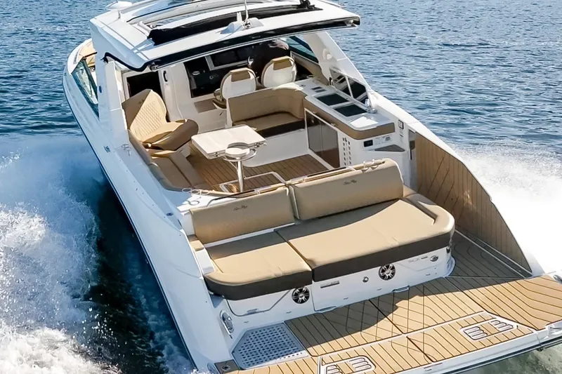 Slide: The Image of 2025 Sea Ray SLX 400 luxury boat cruising on open water. - 10