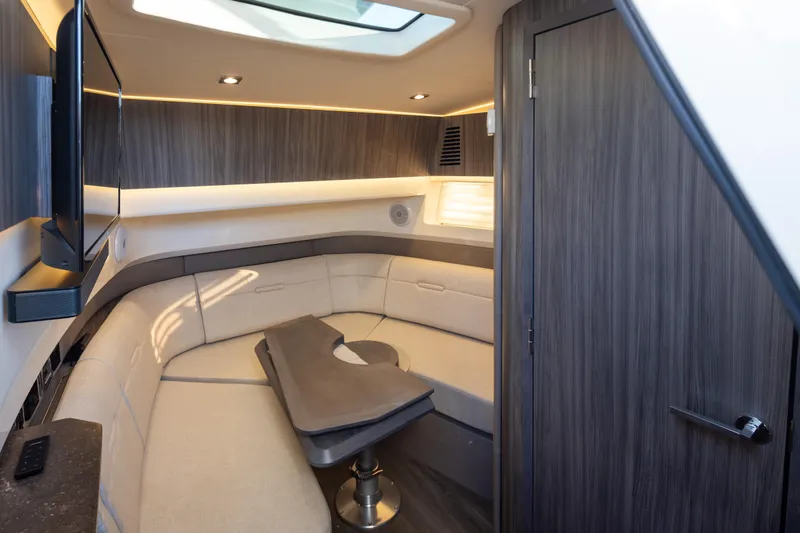 Slide: The Image of Luxurious interior of 2025 Sea Ray SLX 400 yacht with elegant seating and modern design. - 11