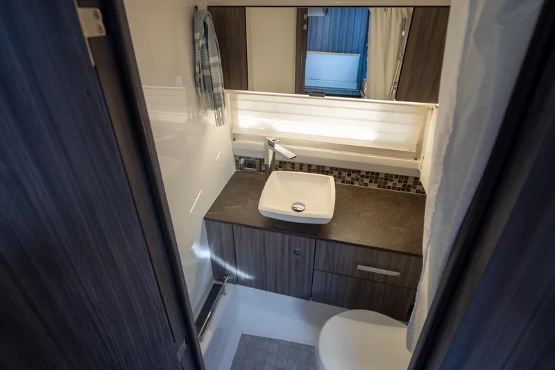 Slide: The Image of Luxurious bathroom in 2025 Sea Ray SLX 400 yacht with modern fixtures and elegant design. - 13