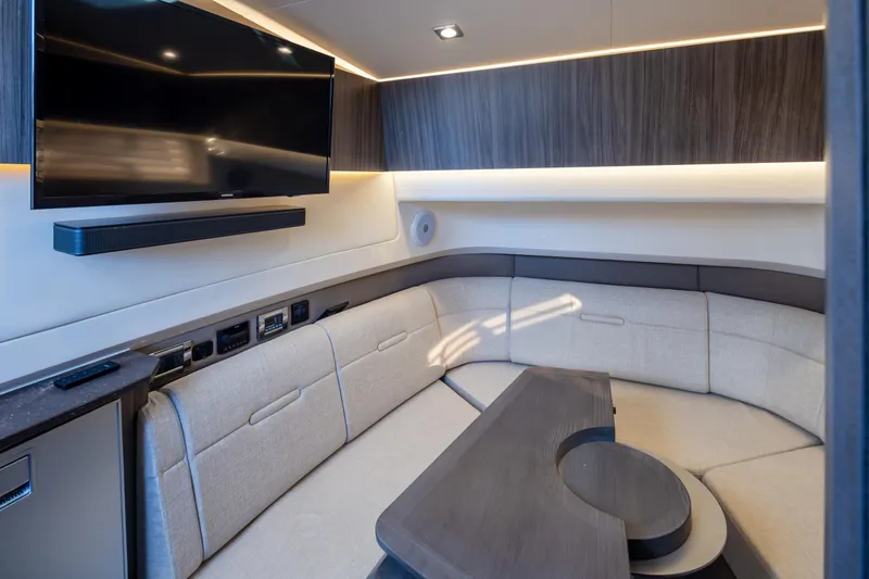 Slide: The Image of Luxurious interior of 2025 Sea Ray SLX 400 yacht with modern seating and entertainment system. - 14