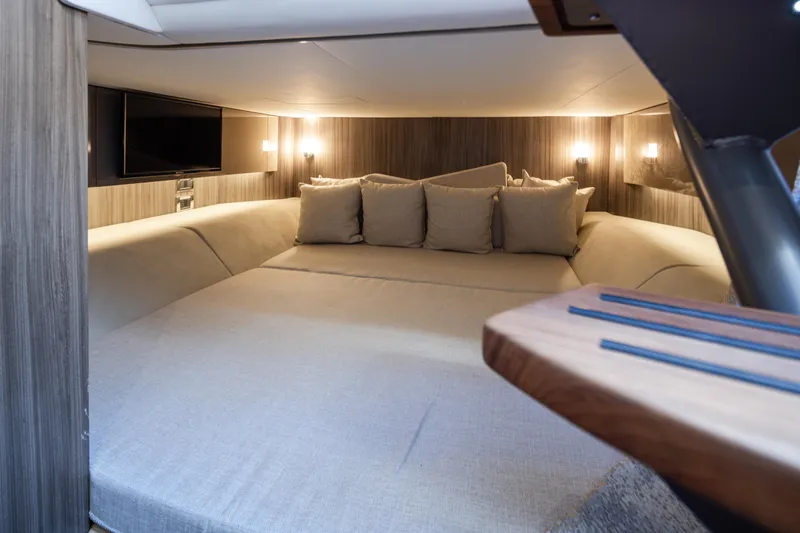 Slide: The Image of Luxurious interior cabin of 2025 Sea Ray SLX 400 yacht with cozy bedding and ambient lighting. - 18